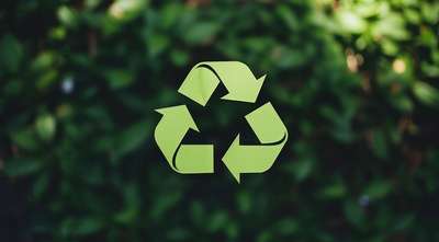Recycling symbol on green background
