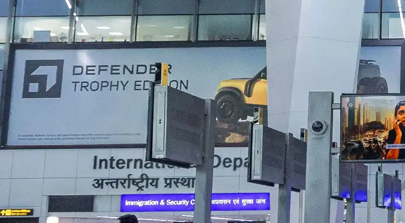 International departures area featuring large wall advertisement