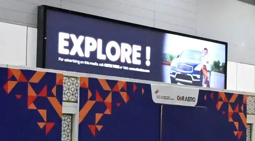Illuminated airport billboard with promotional message