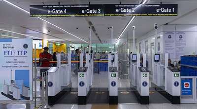 Automated immigration e-gates in an airport terminal for trusted travelers.