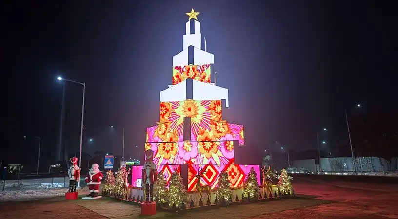 Giant illuminated Christmas tree display at night
