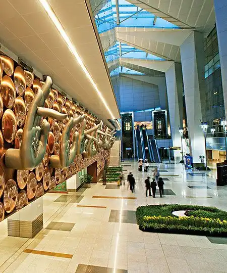 Interior with large art wall and escalators