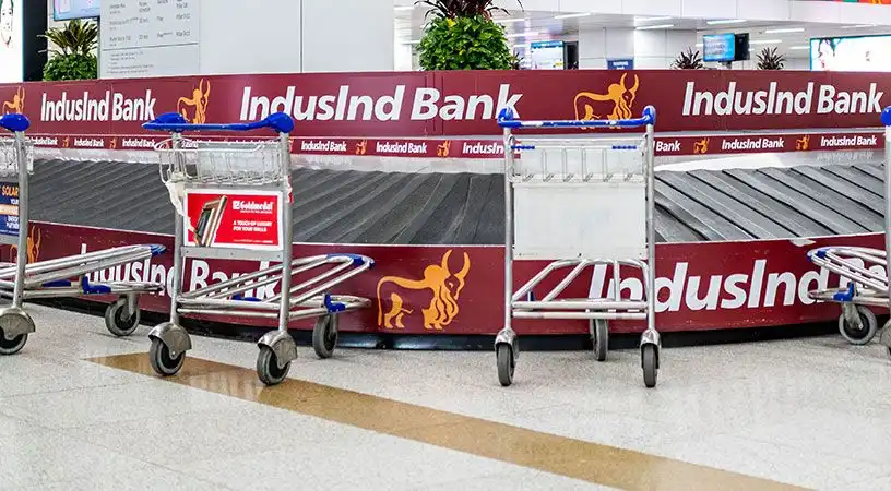 Baggage carousel area with branded panel advertisements
