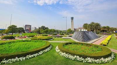 Landscaped garden near airport with control tower in view